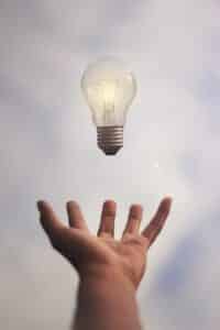 light bulb levitating over a hand at marriage coach near me in Mt Pleasant