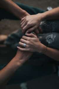 couples holding hand during a talk with a marriage therapist near me in Mt Pleasant, SC