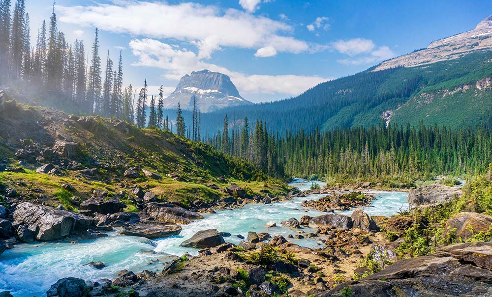 Time-lapse photography of a river showing flowing water moving rapidly over rocks.