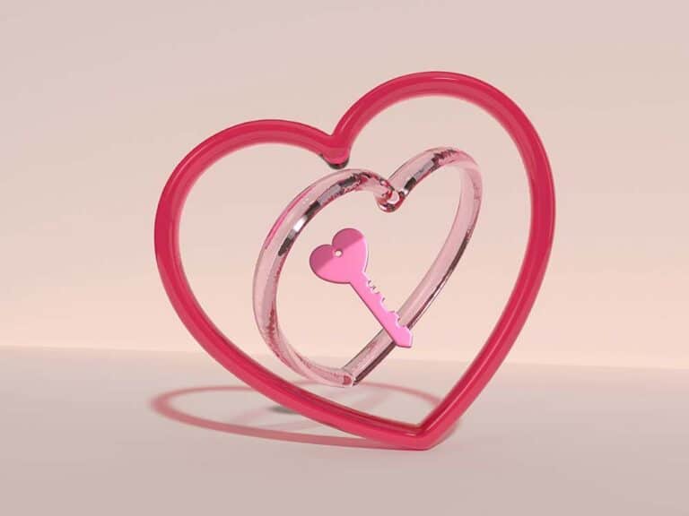 A Pink Heart Shaped Object with a Key Inside of It