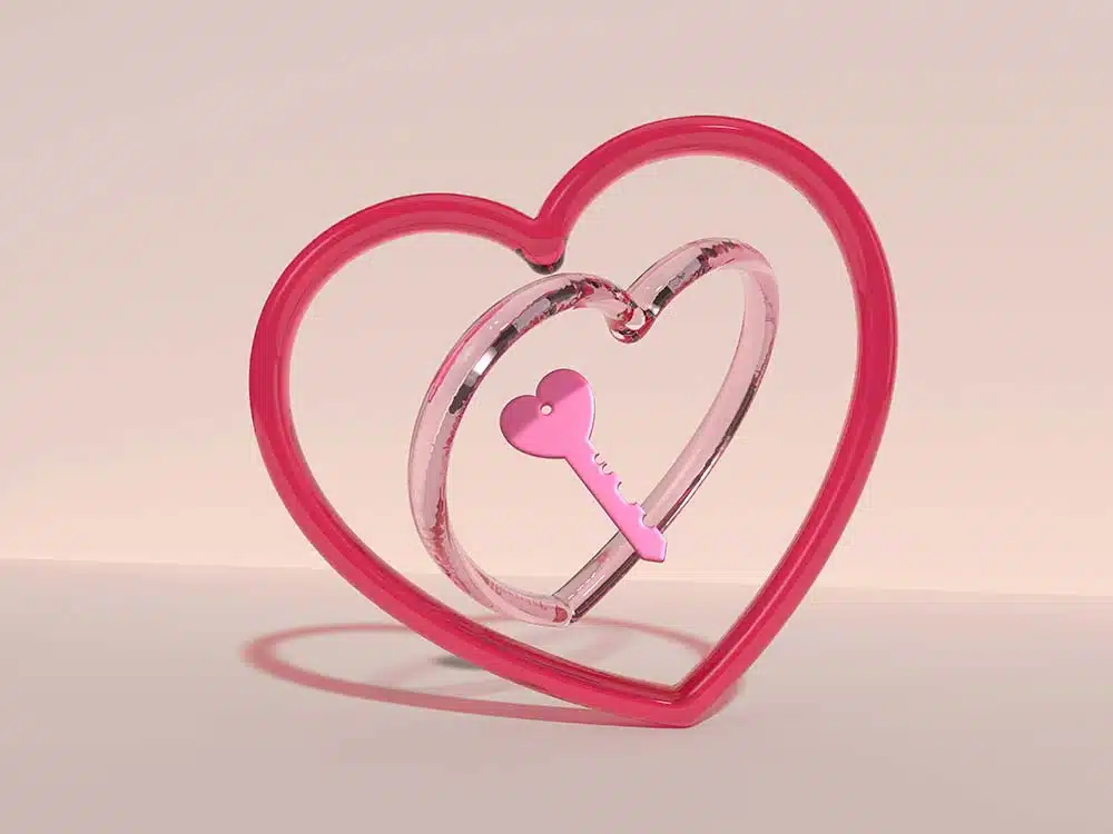A Pink Heart Shaped Object with a Key Inside of It