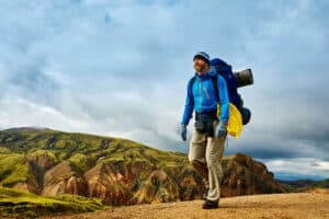 Man hiking along a trail in the Icelandic mountains